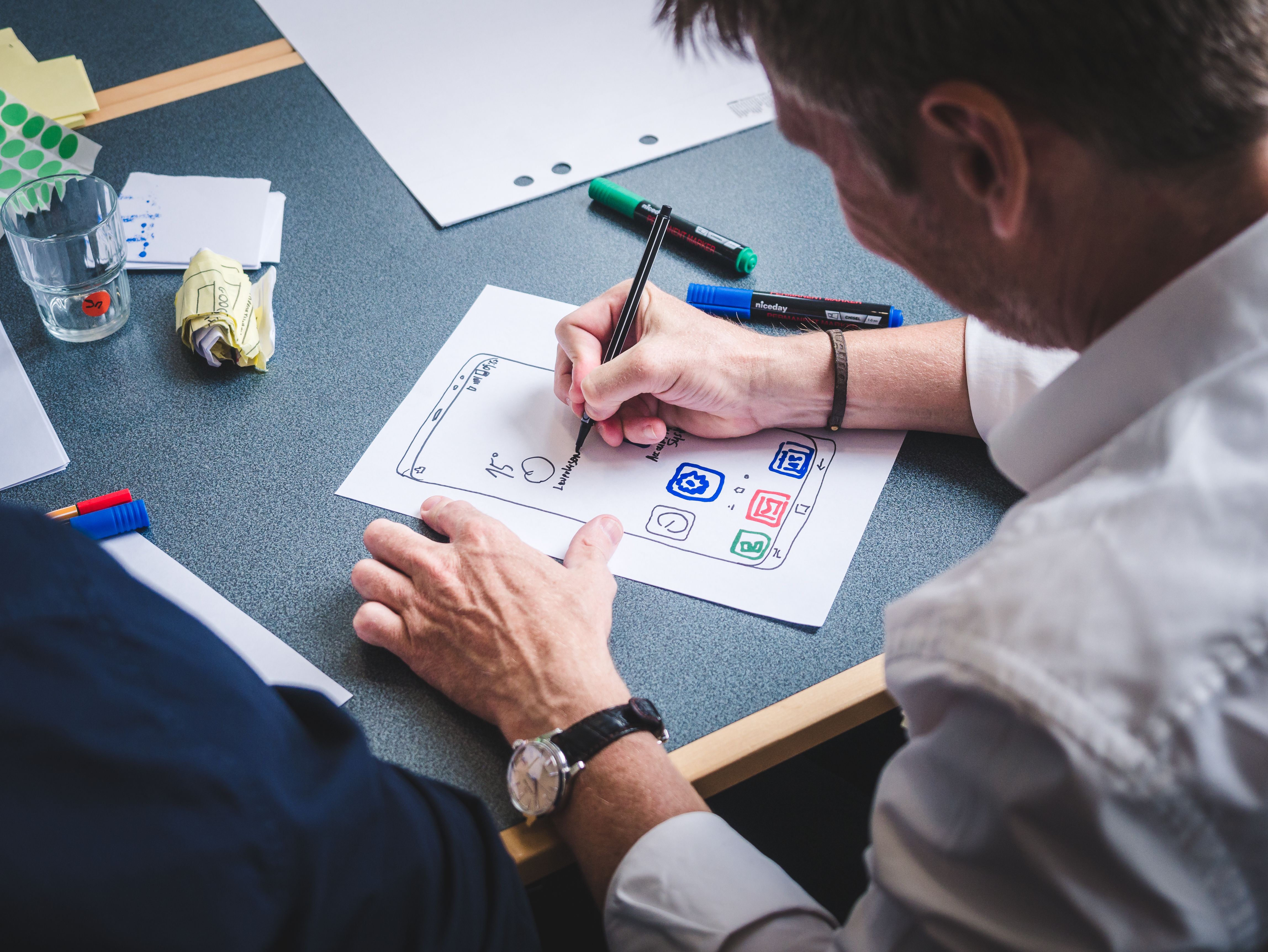 UX design deliverables showing research report, Figma design files, conversion baseline measurement, and paid traffic landing page optimization from Klyverai